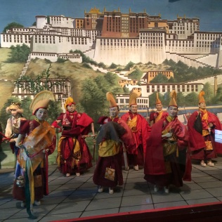Diorama set against backdrop of Potala Palace